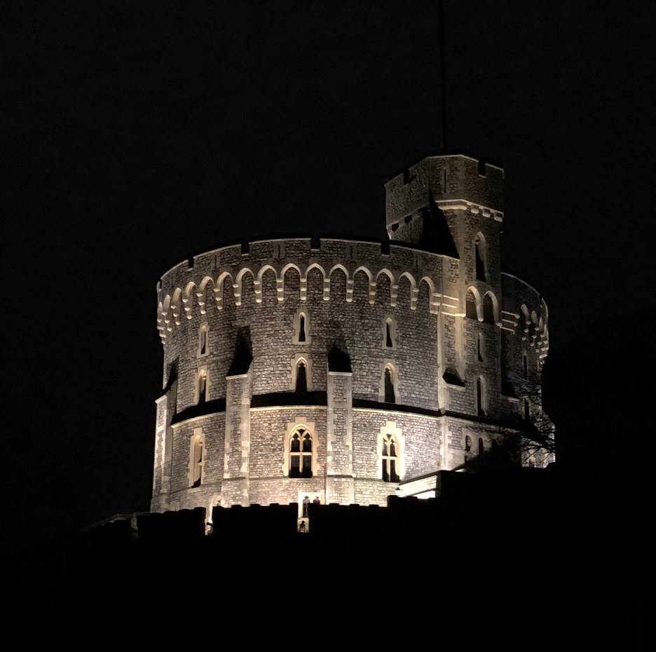 Tower at Windsor Castle at night lit from below.